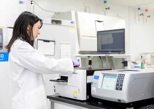 Female researcher using advanced laboratory equipment