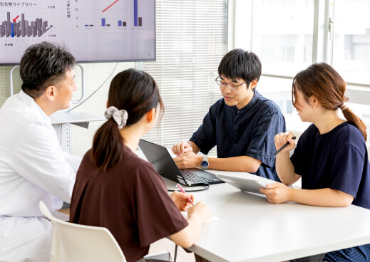 Researchers of various ages and specialties having a discussion