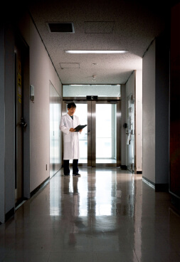 Researcher standing in the hallway of the research building